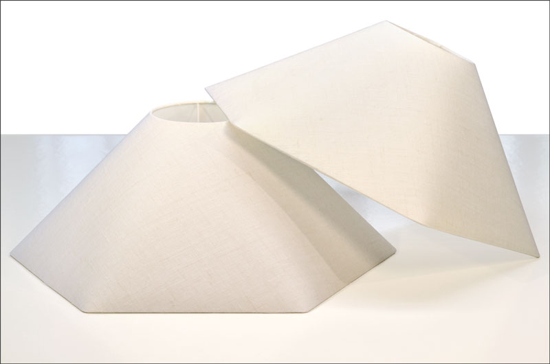 Custom-made white linen lampshades reproduced with the original fitters.